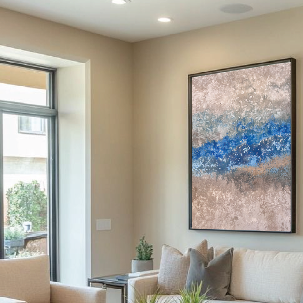 Modern living room with beige sofas, a glass coffee table, and abstract art on the wall.