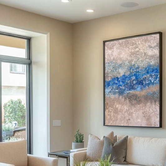 Modern living room with beige sofas, a glass coffee table, and abstract art on the wall.